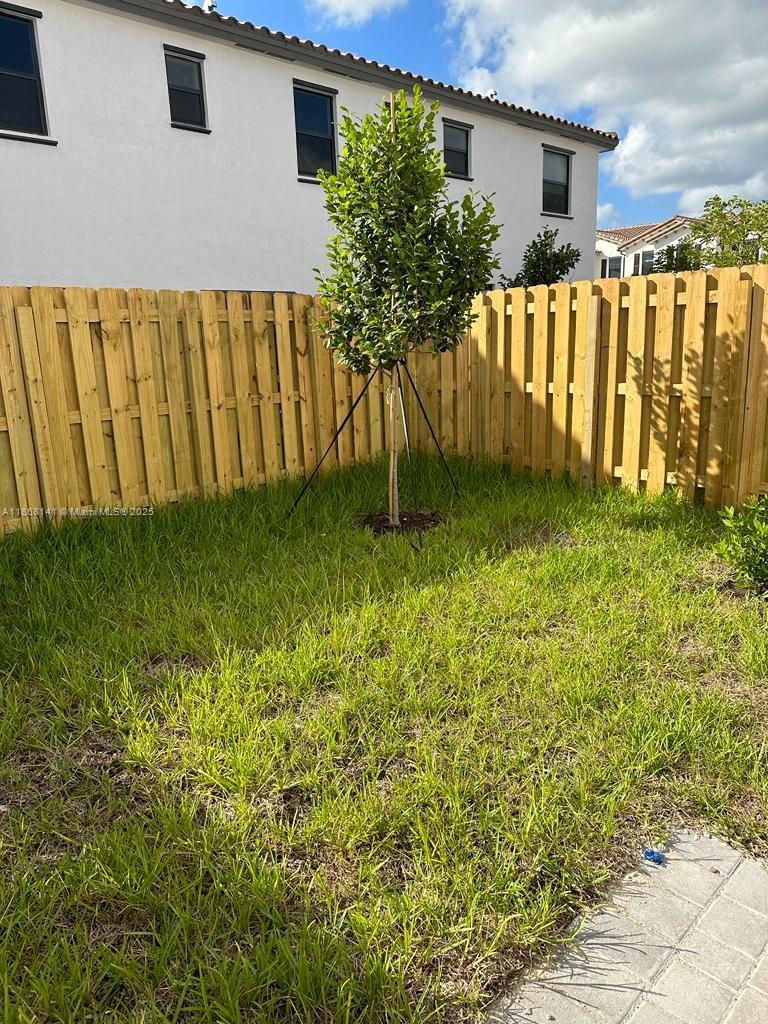 11926 Southwest 245 Terrace Homestead, FL 33032 - Photo 25 of 43 a backyard of a house with plants and large tree