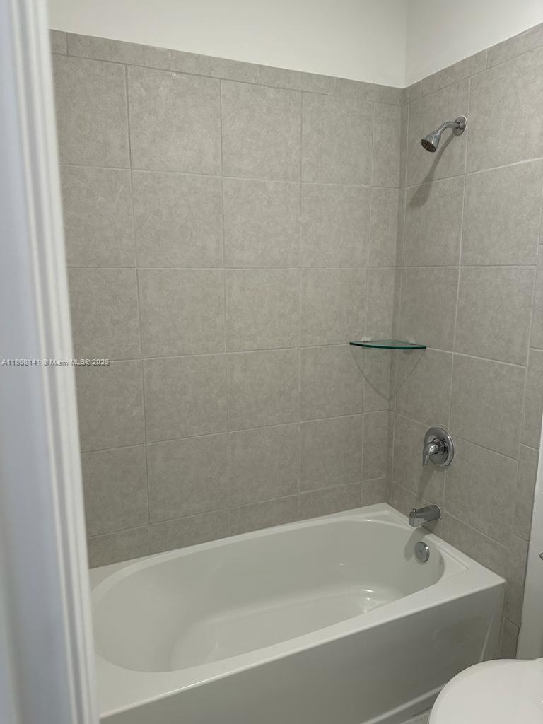 11926 Southwest 245 Terrace Homestead, FL 33032 - Photo 31 of 43 a bathroom with a bathtub