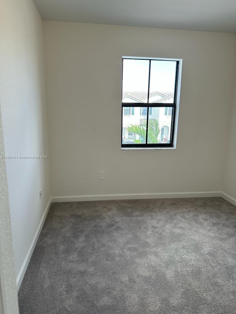 11926 Southwest 245 Terrace Homestead, FL 33032 - Photo 38 of 43 an empty room with a window