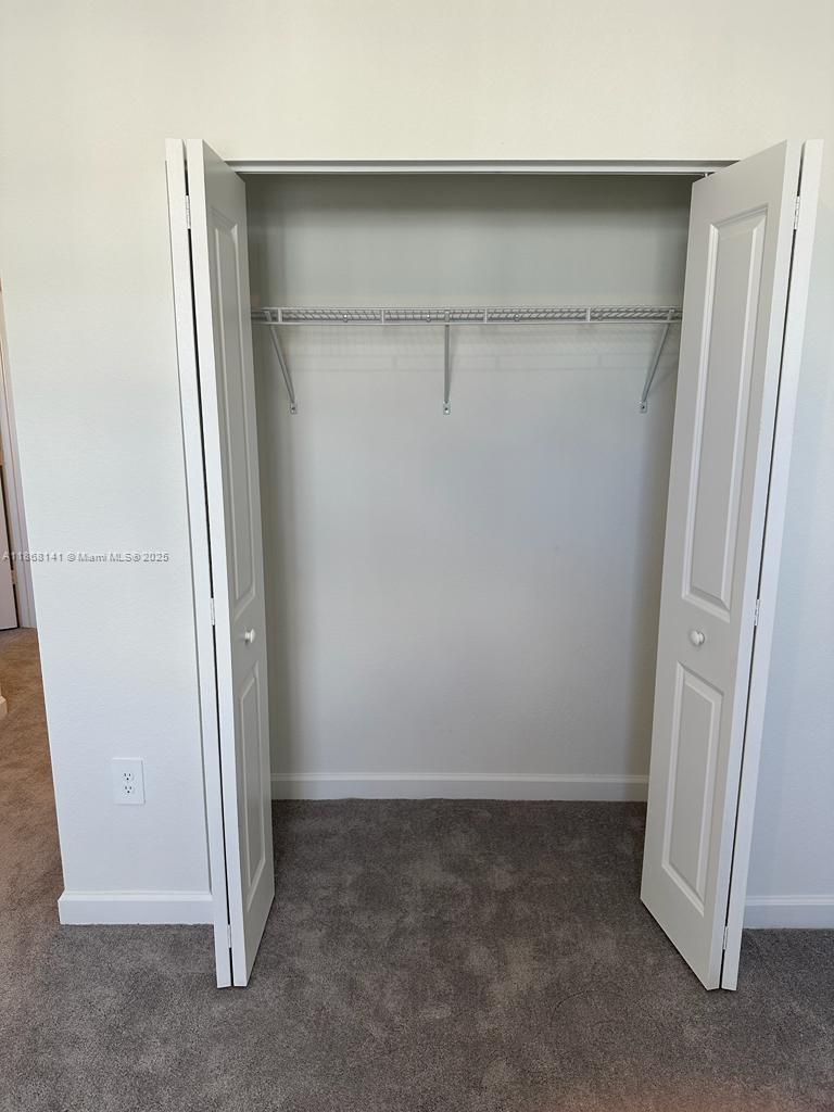 11926 Southwest 245 Terrace Homestead, FL 33032 - Photo 43 of 43 an empty room with a door