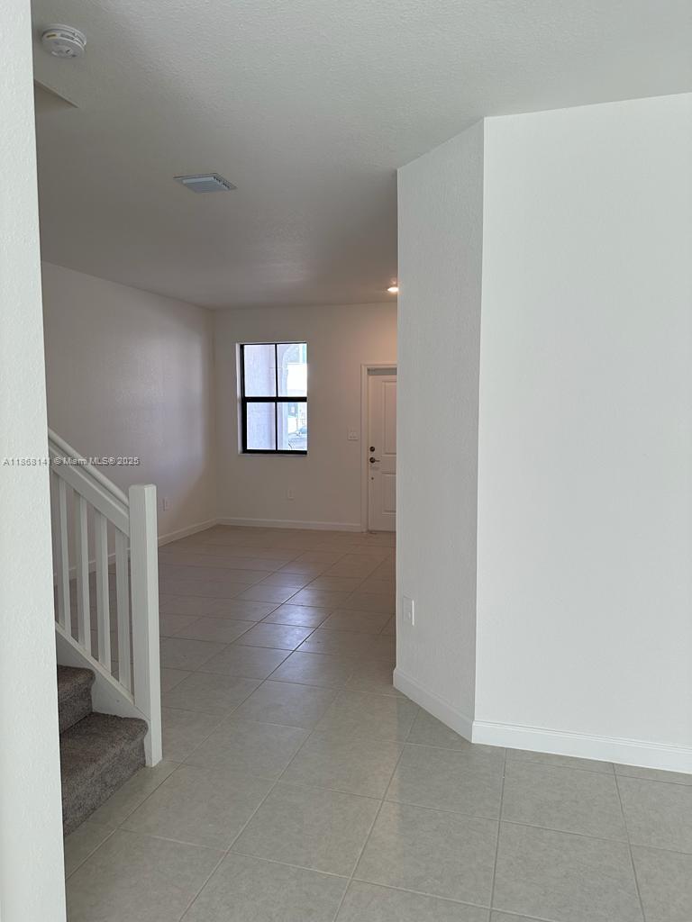 11926 Southwest 245 Terrace Homestead, FL 33032 - Photo 10 of 43 an empty room with windows