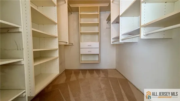 a bathroom with a tub and shower