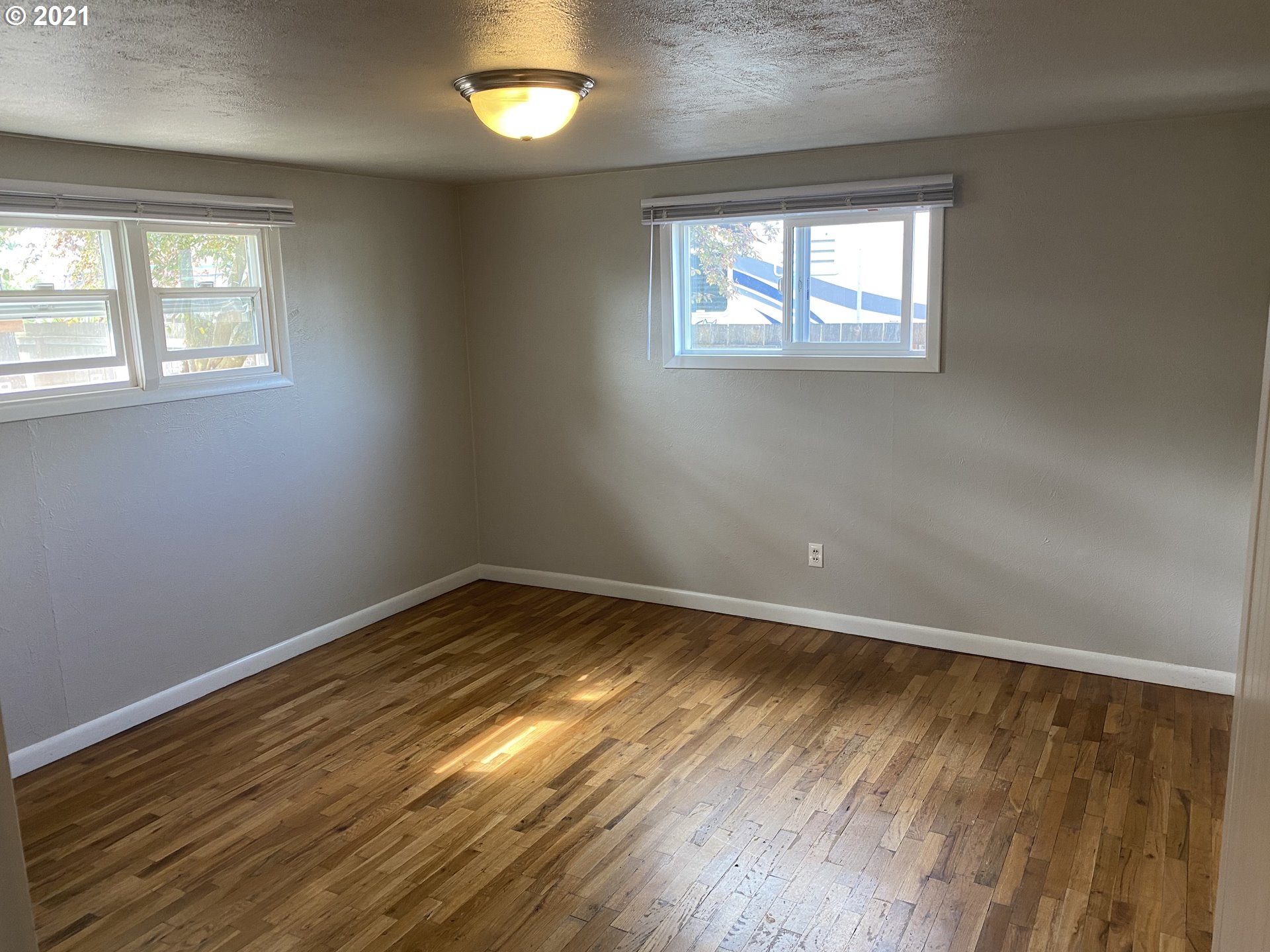 504 38th Street Springfield, OR 97478 - Photo 8 of 18 a view of an empty room and window