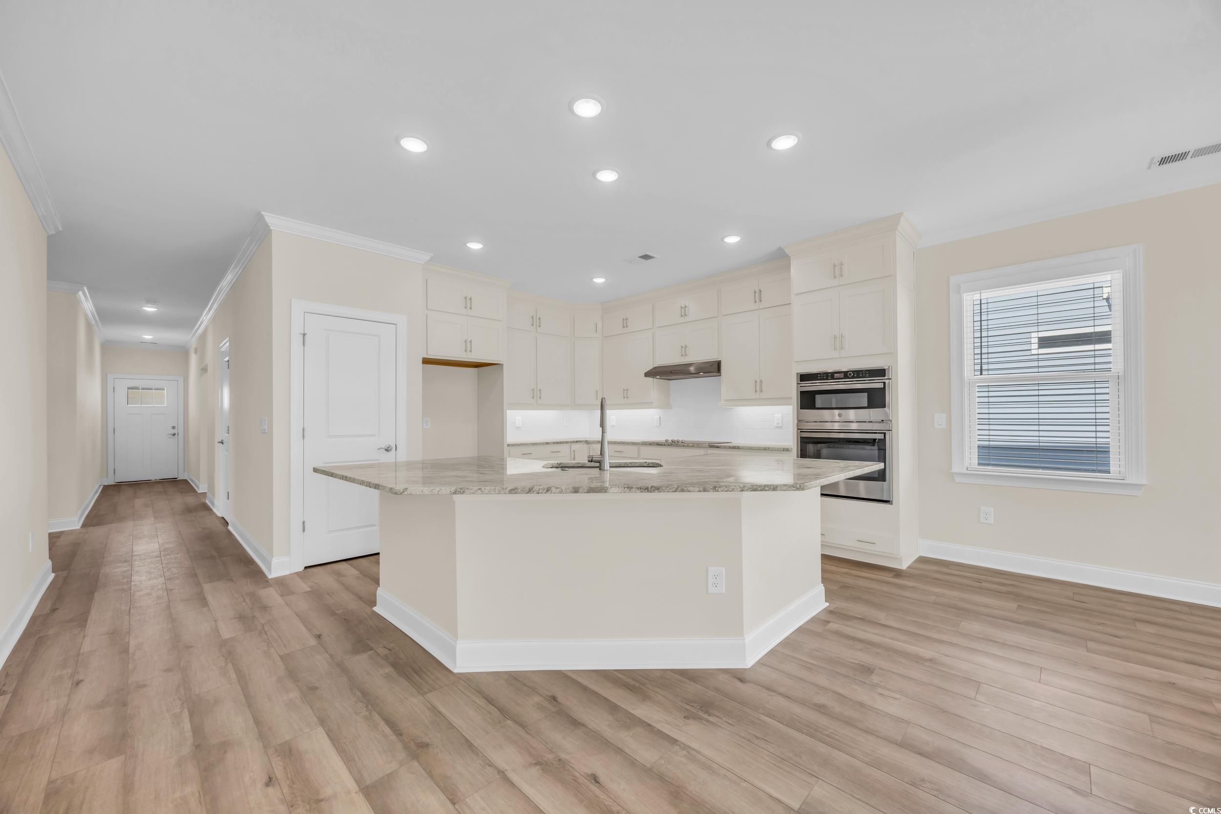 546 Beckham Court Murrells Inlet, SC 29576 - Photo 16 of 34 Kitchen featuring light stone countertops, sink, a