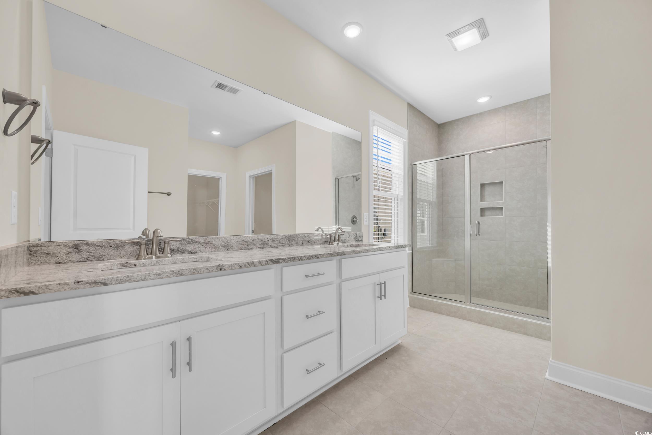 546 Beckham Court Murrells Inlet, SC 29576 - Photo 21 of 34 Bathroom with tile patterned flooring, vanity, and