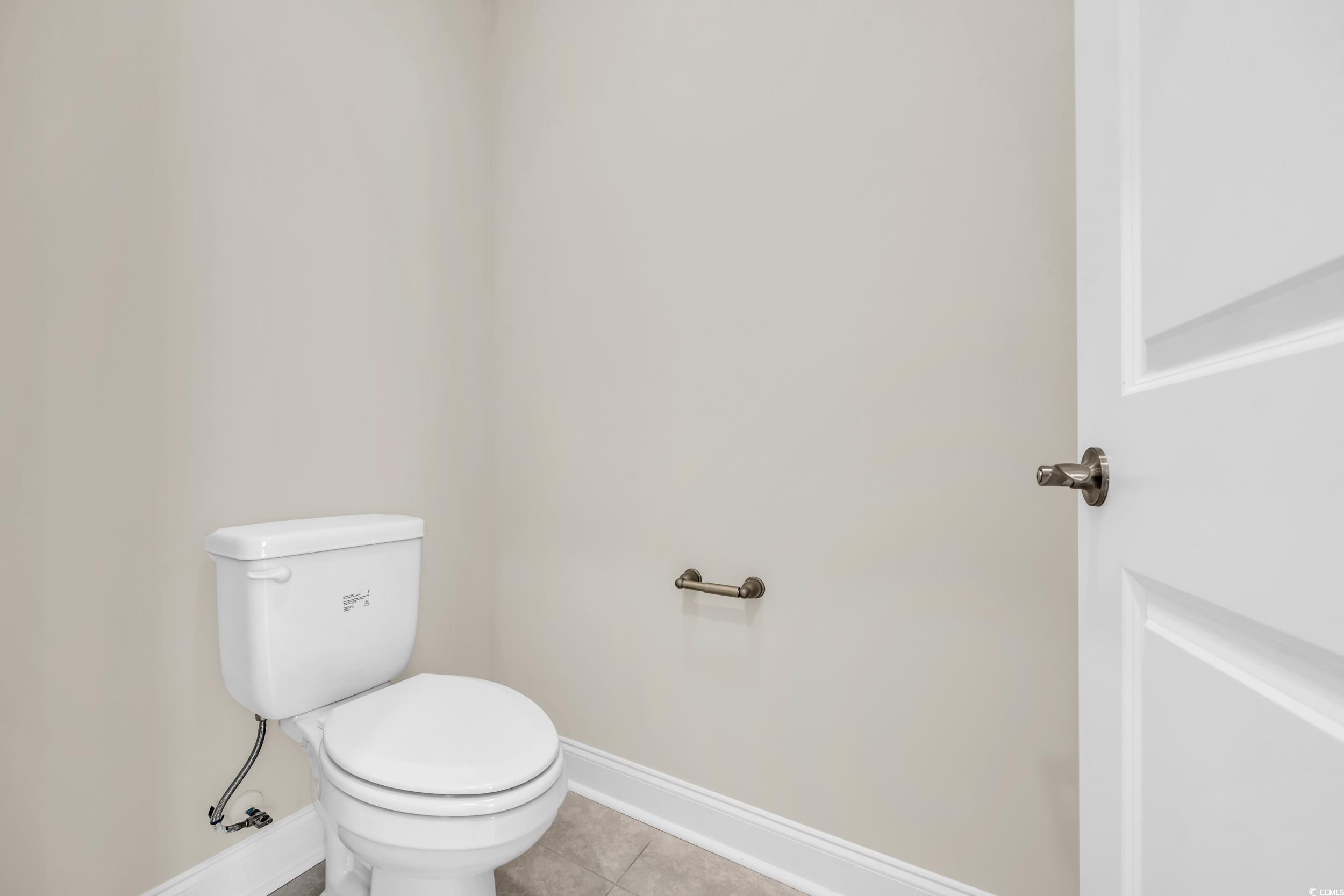 546 Beckham Court Murrells Inlet, SC 29576 - Photo 22 of 34 Bathroom featuring toilet and tile patterned floor
