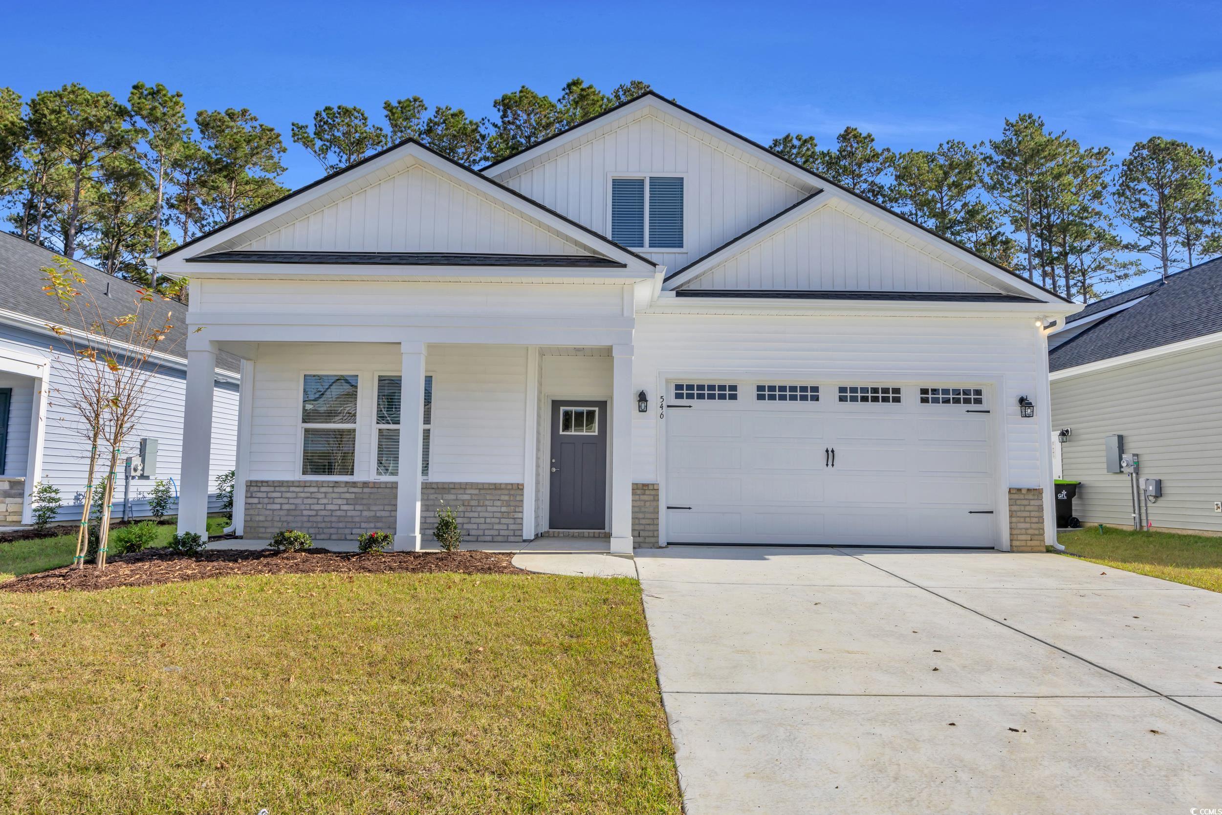 546 Beckham Court Murrells Inlet, SC 29576 - Photo 5 of 34 View of front facade featuring a garage, a front y