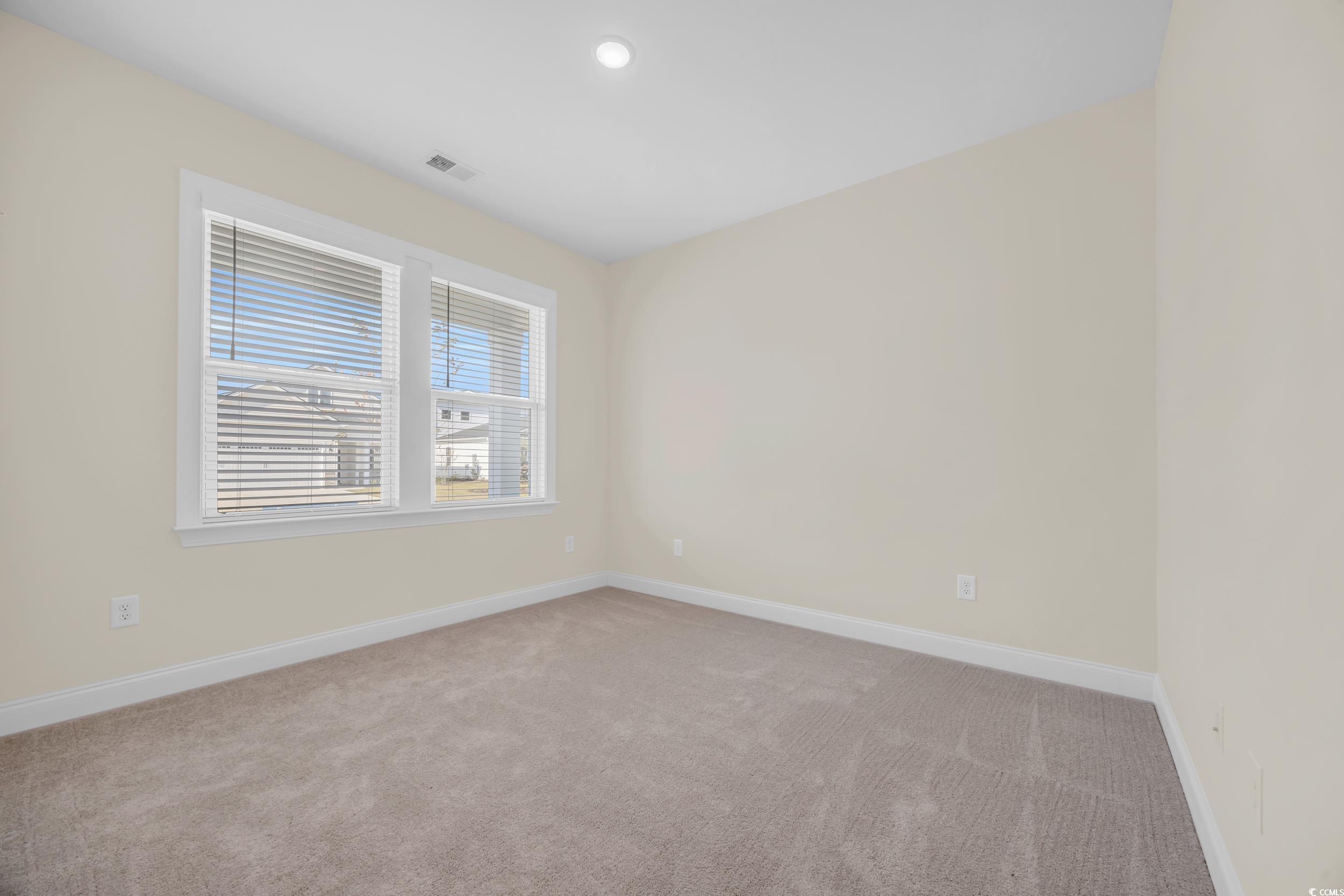 546 Beckham Court Murrells Inlet, SC 29576 - Photo 9 of 34 Unfurnished room featuring light carpet