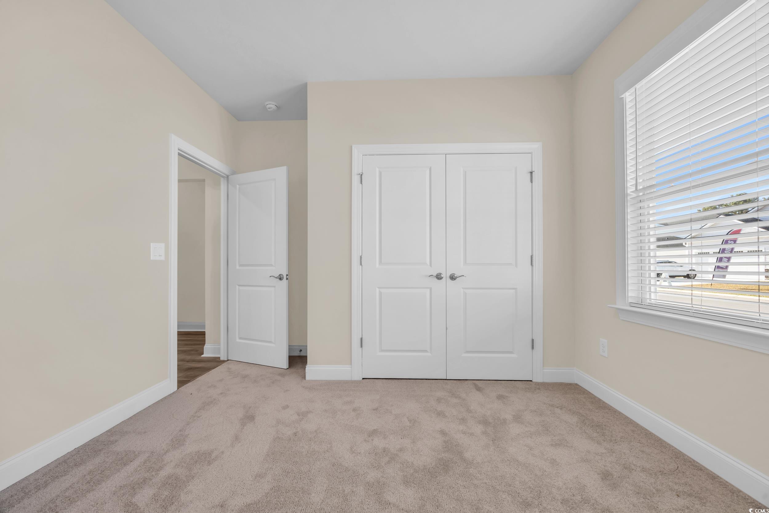 546 Beckham Court Murrells Inlet, SC 29576 - Photo 10 of 34 Unfurnished bedroom featuring light colored carpet