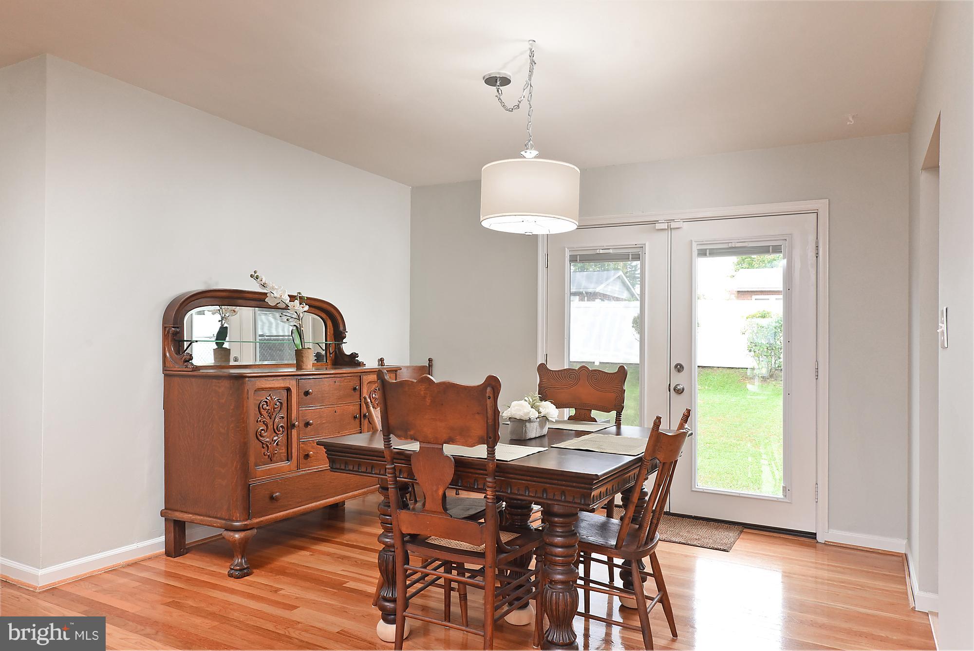Dining room opens up to the gorgeous back yard.