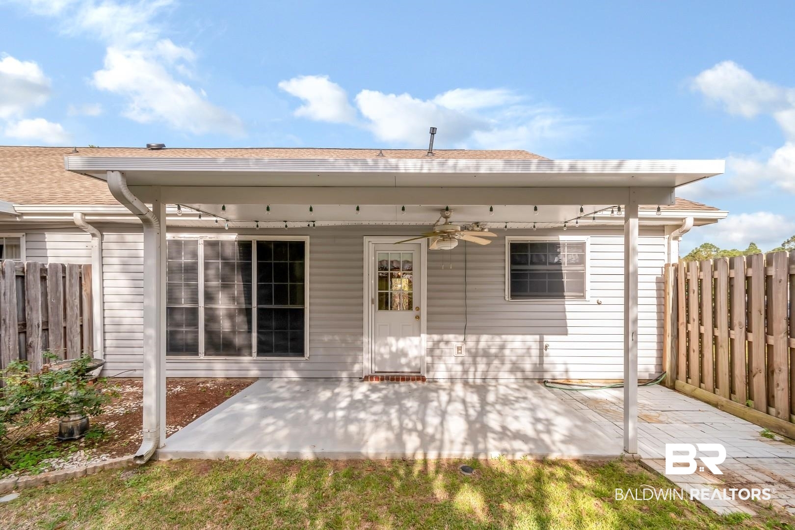 672 Spring Lake Drive East Mobile, AL 36695 - Photo 5 of 26 Back of house with a shingled roof, a patio area, fence, and ceiling fan
