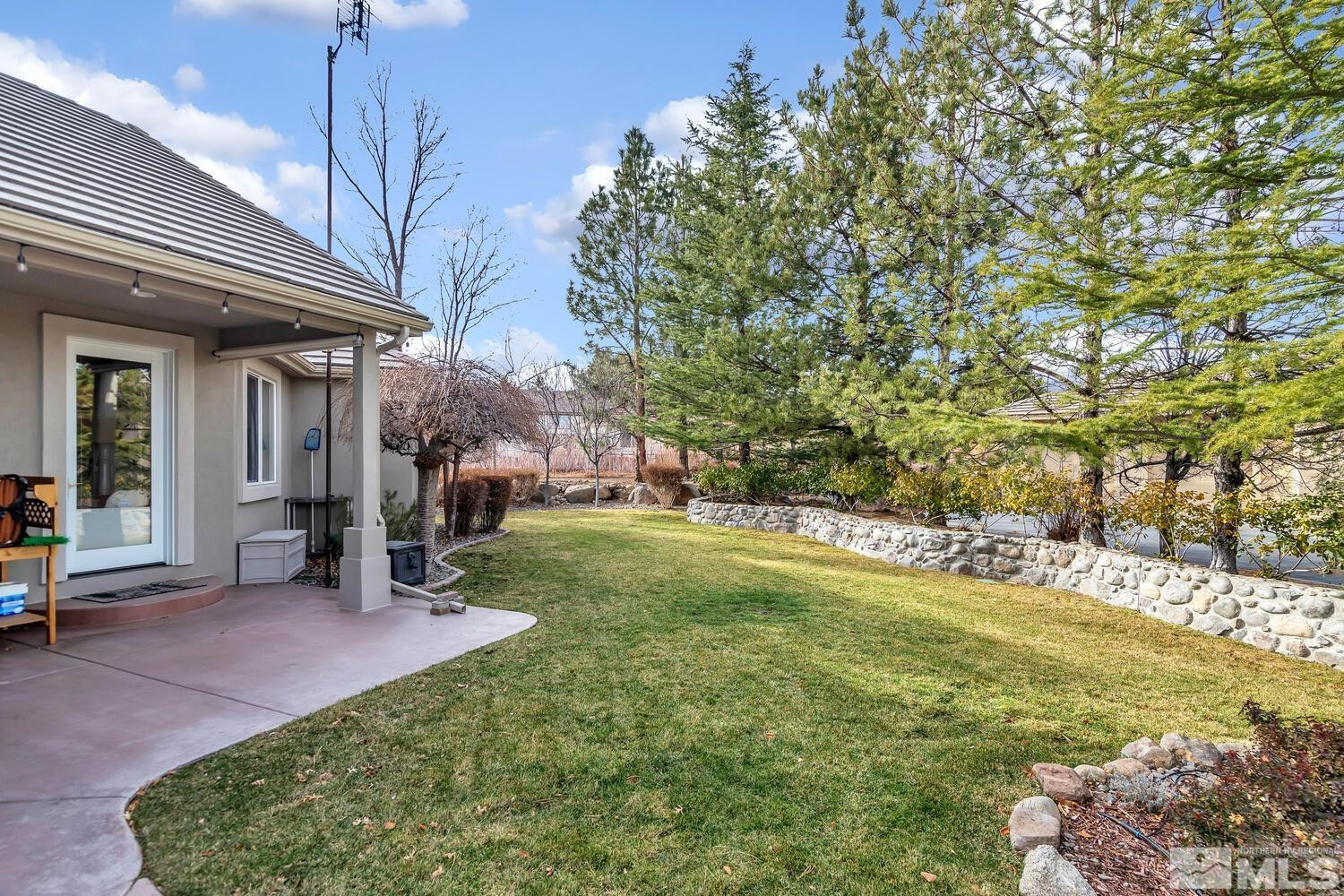 1465 Wolf Run Road Reno, NV 89511 - Photo 35 of 40 a view of a house with a backyard porch and sitting area