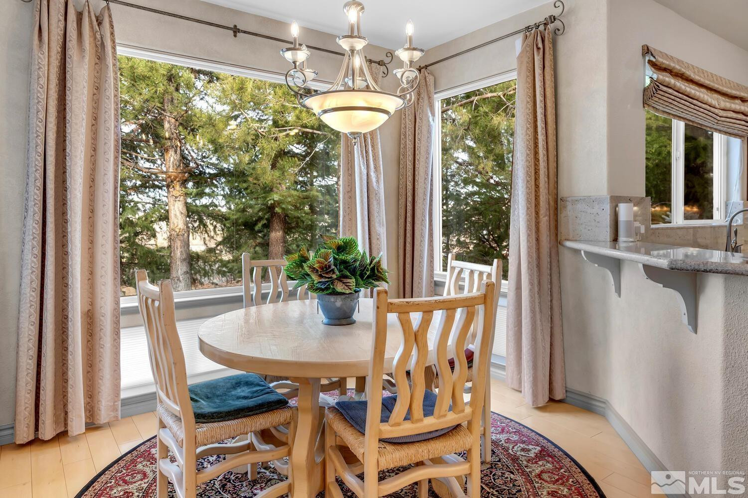 1465 Wolf Run Road Reno, NV 89511 - Photo 10 of 40 a dining room with furniture window and outside view