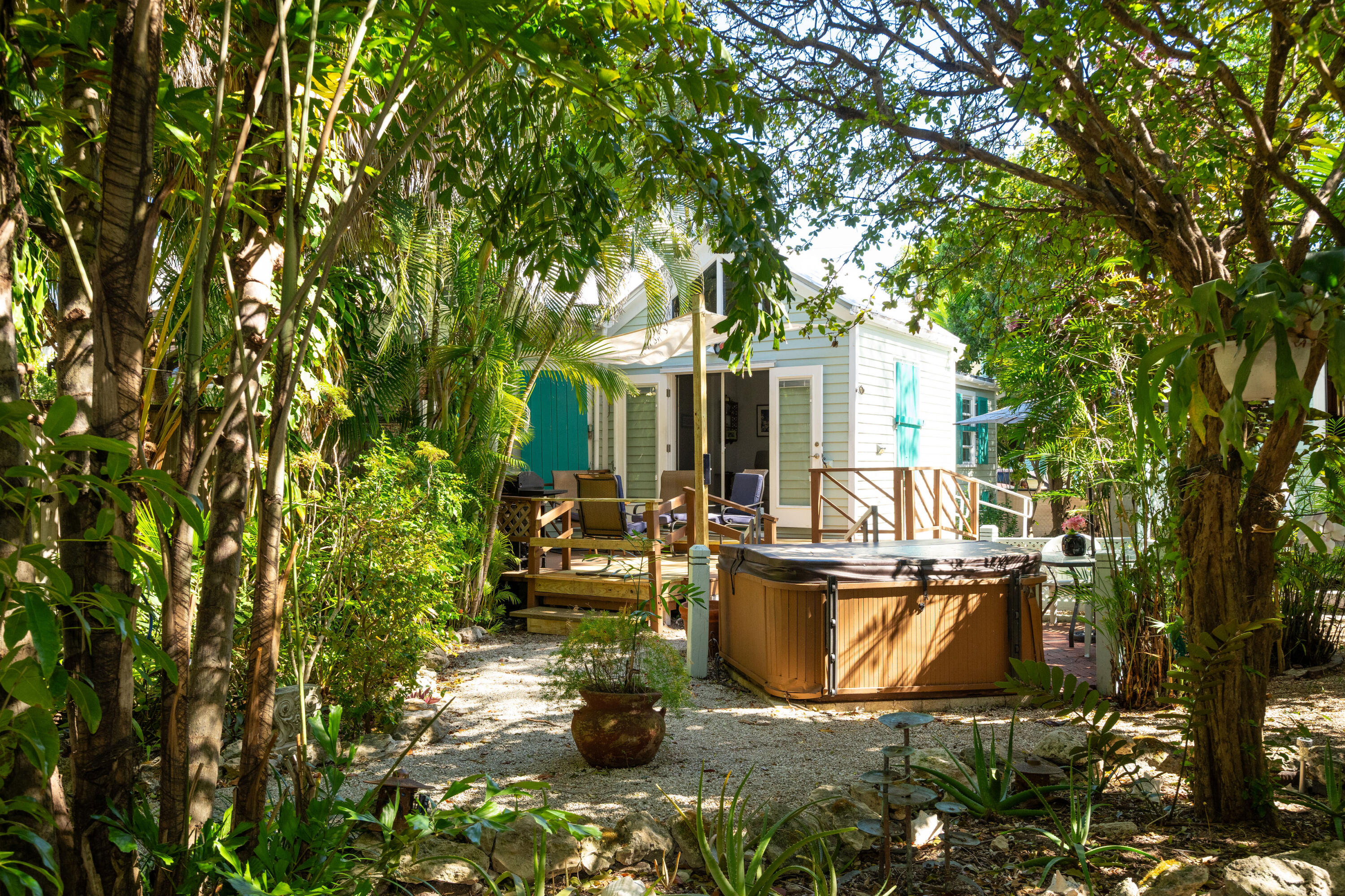 530 White Street Key West, FL 33040 - Photo 19 of 69 a view of a patio with table and chairs and potted plants