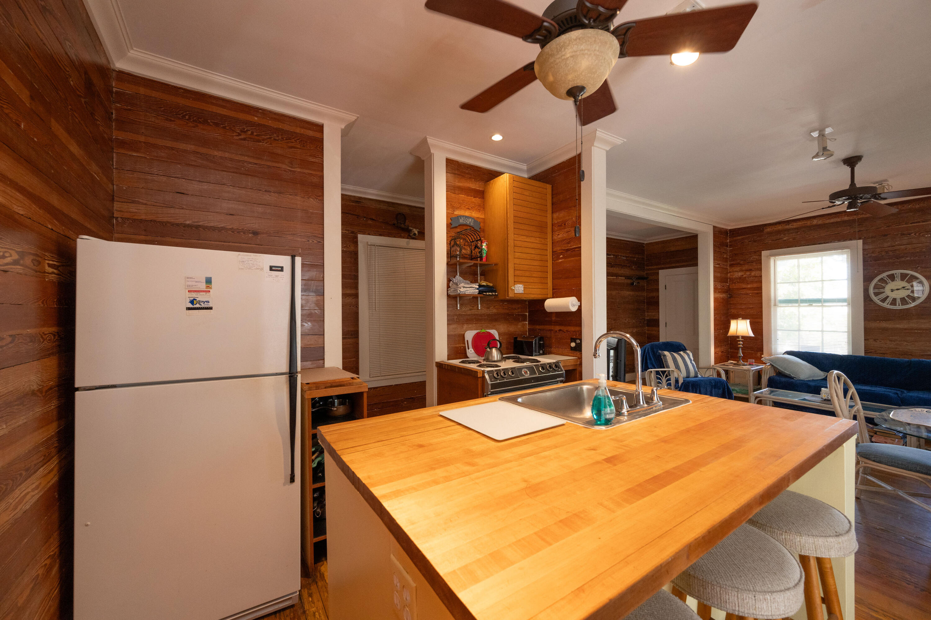 530 White Street Key West, FL 33040 - Photo 27 of 69 a kitchen with stainless steel appliances refrigerator dining table and chairs
