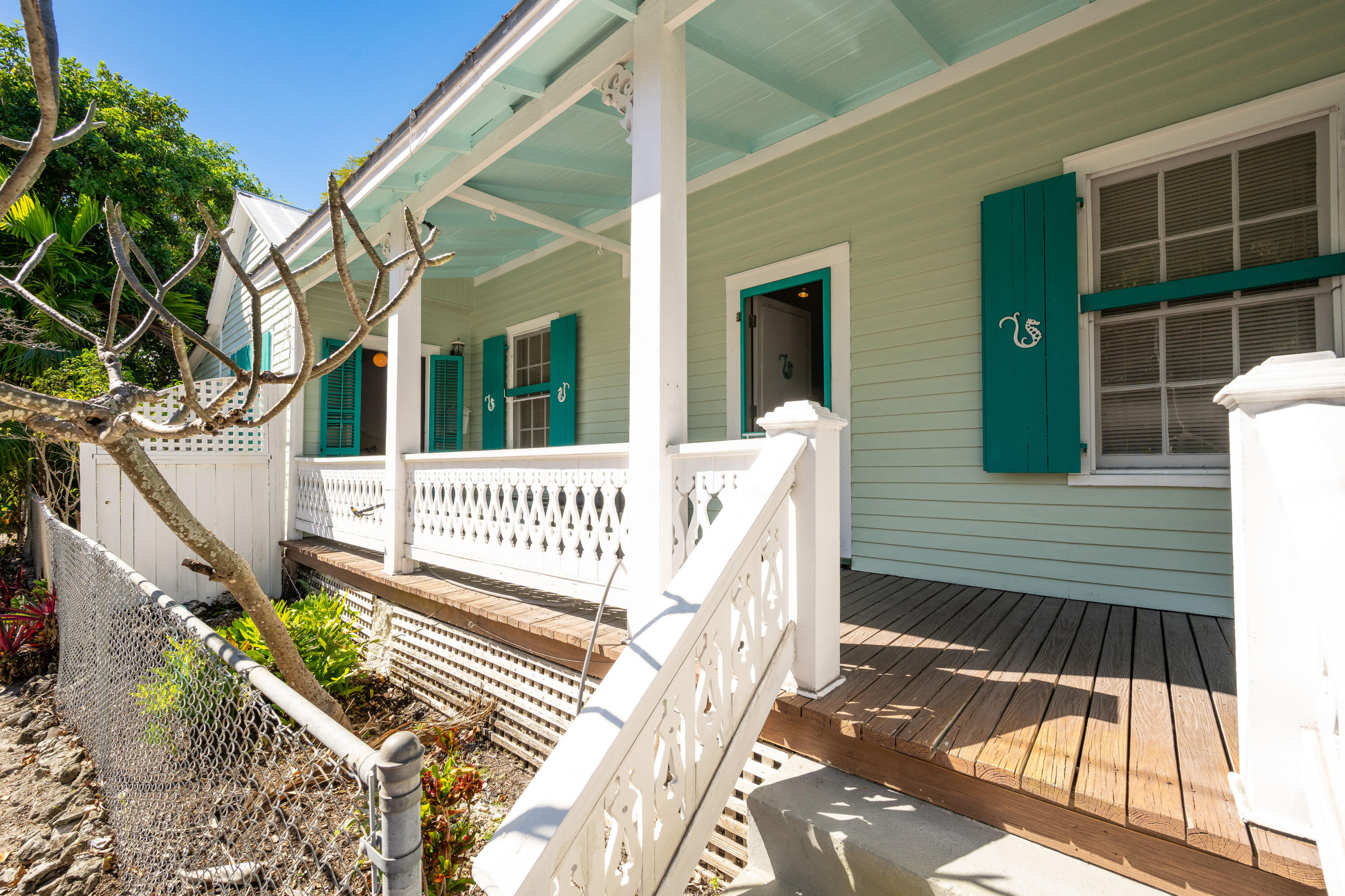 530 White Street Key West, FL 33040 - Photo 3 of 69 a view of a house with a small yard and wooden floor and fence