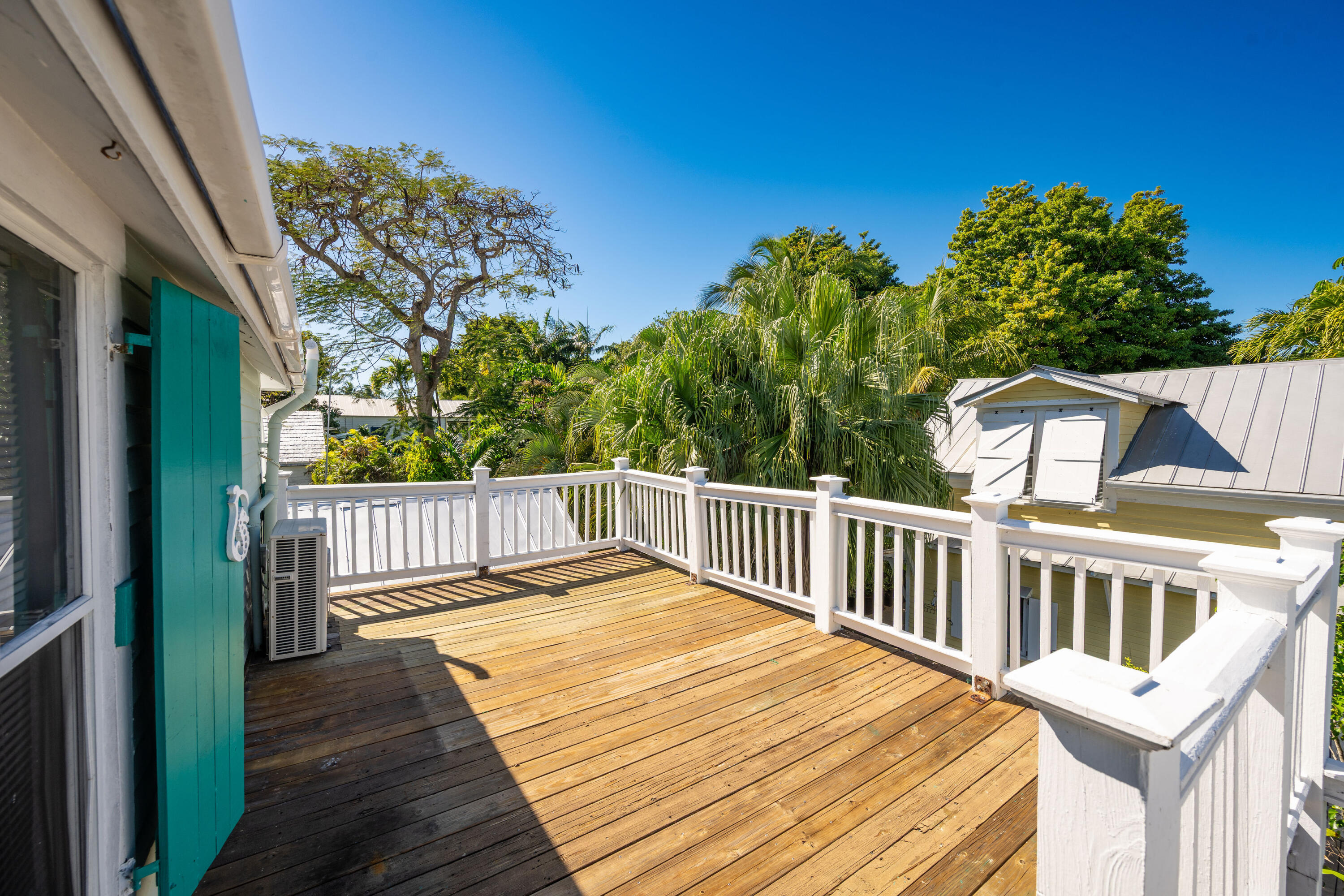 530 White Street Key West, FL 33040 - Photo 41 of 69 a balcony with wooden floor and fence
