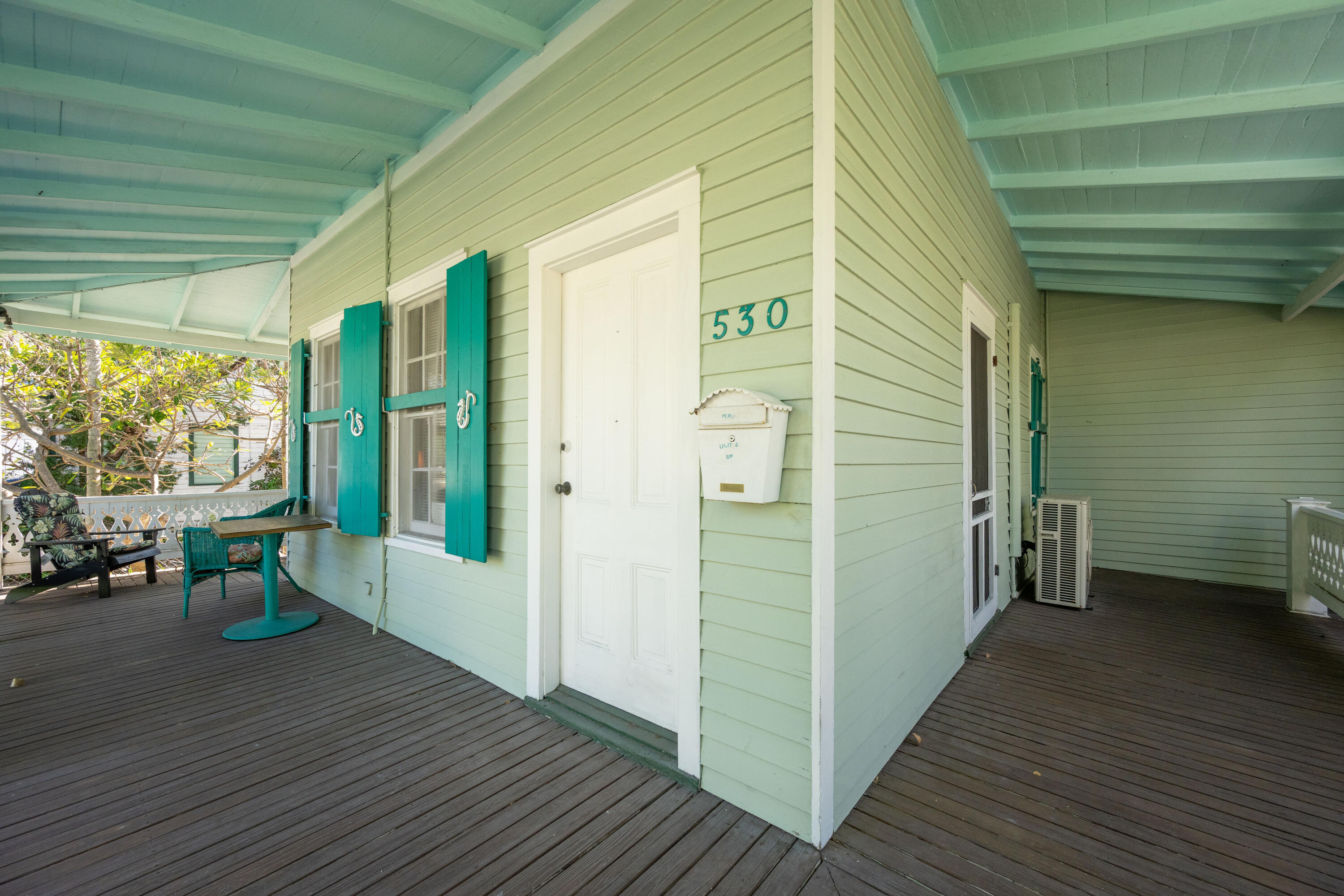 530 White Street Key West, FL 33040 - Photo 60 of 69 a view of a porch with wooden floor and a tub