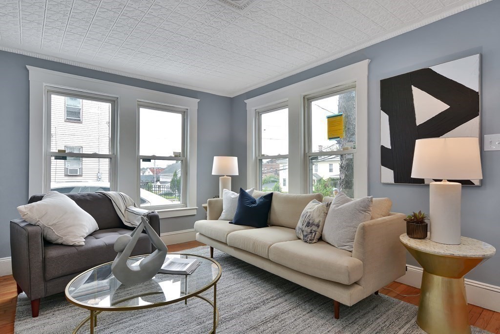 47 Moore Street Lowell, MA 01852 - Photo 1 of 36 a living room with furniture and a large window