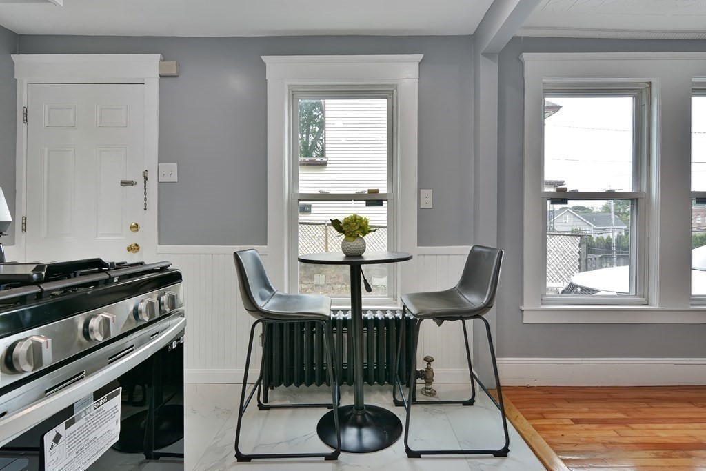 47 Moore Street Lowell, MA 01852 - Photo 15 of 36 a view of a dining room with furniture window and outside view