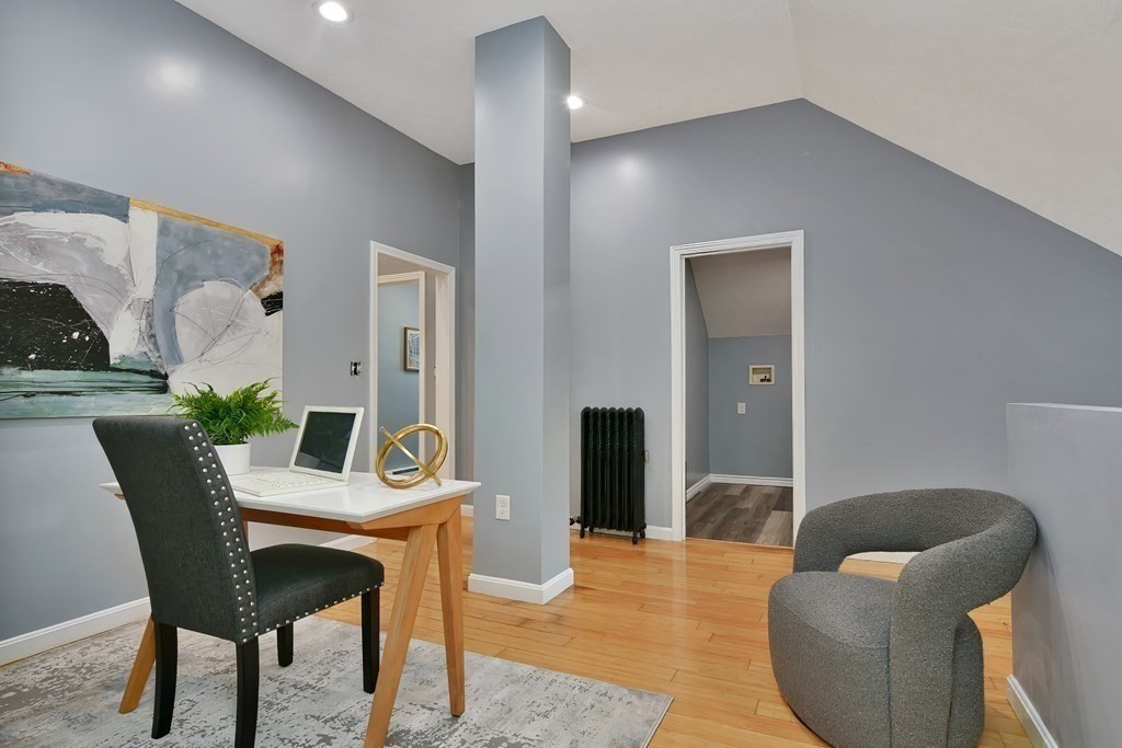 47 Moore Street Lowell, MA 01852 - Photo 26 of 36 a dining room with furniture and wooden floor