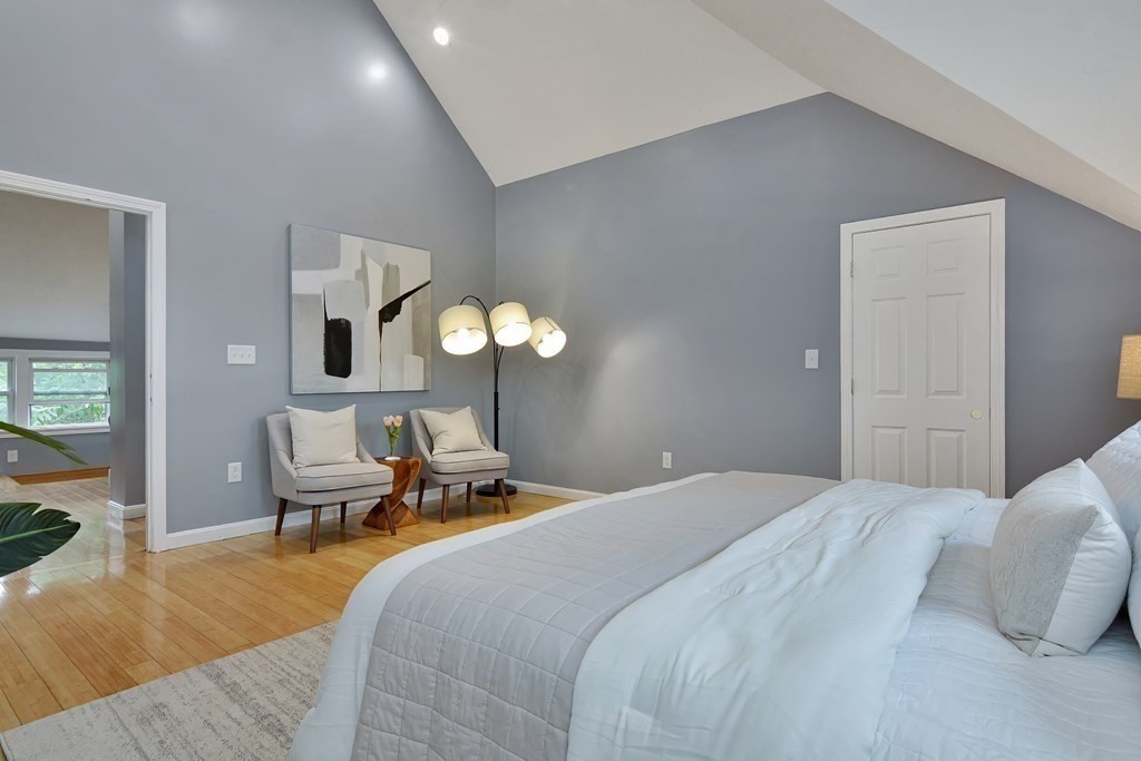 47 Moore Street Lowell, MA 01852 - Photo 32 of 36 a bedroom with a bed and chandelier