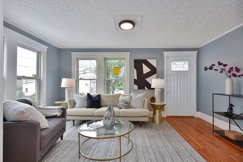 47 Moore Street Lowell, MA 01852 - Photo 6 of 36 a living room with furniture and wooden floor