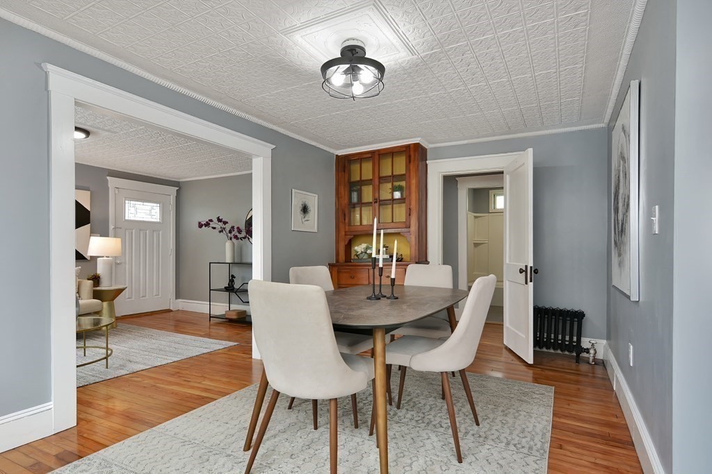 47 Moore Street Lowell, MA 01852 - Photo 10 of 36 a view of a dining room with furniture