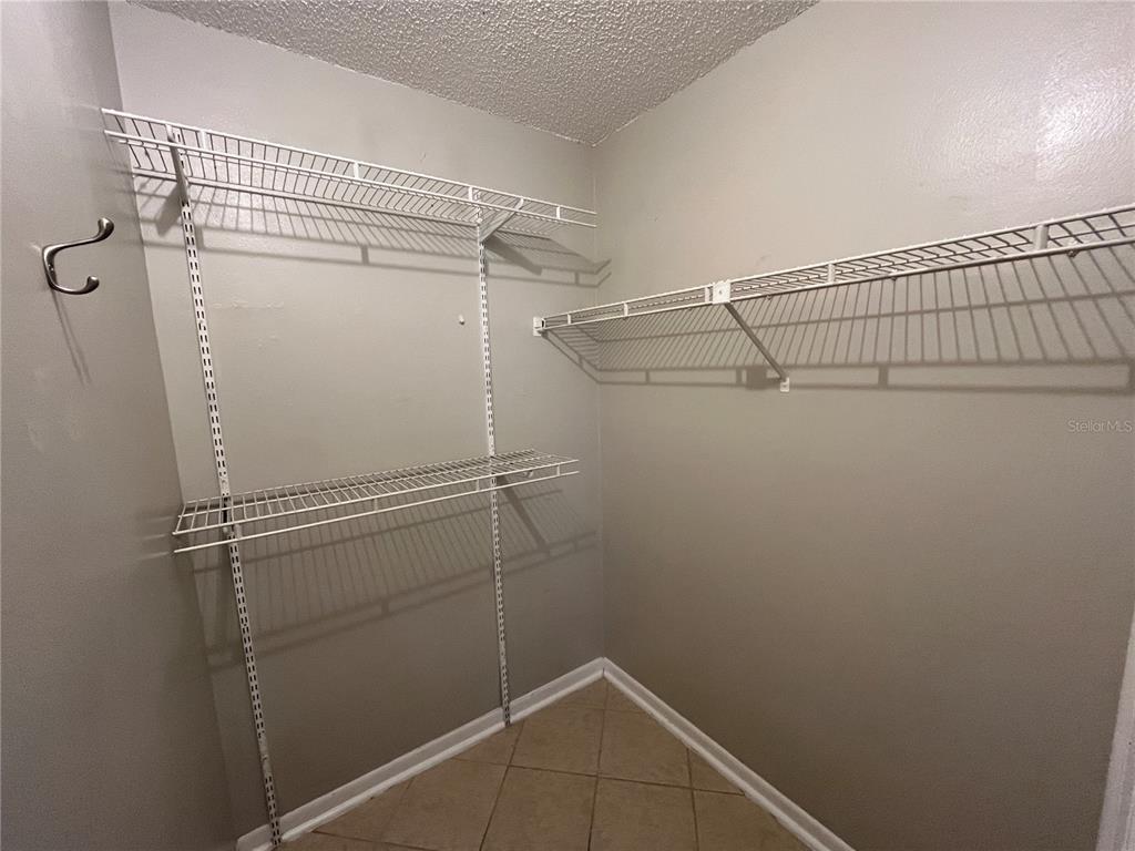 1239 East Ridgewood Street Orlando, FL 32803 - Photo 15 of 15 a view of a room with racks on the wall