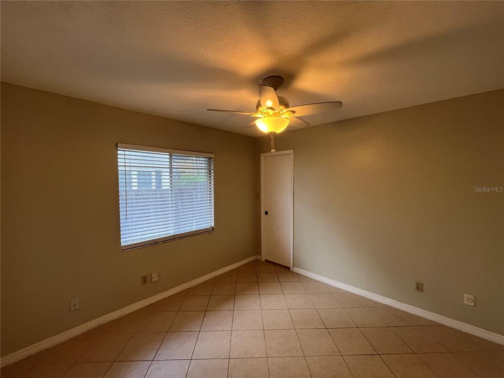 1239 East Ridgewood Street Orlando, FL 32803 - Photo 9 of 15 a view of an empty room with a window