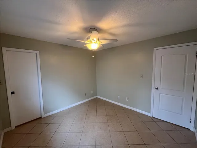 a view of a chandelier fan and closet