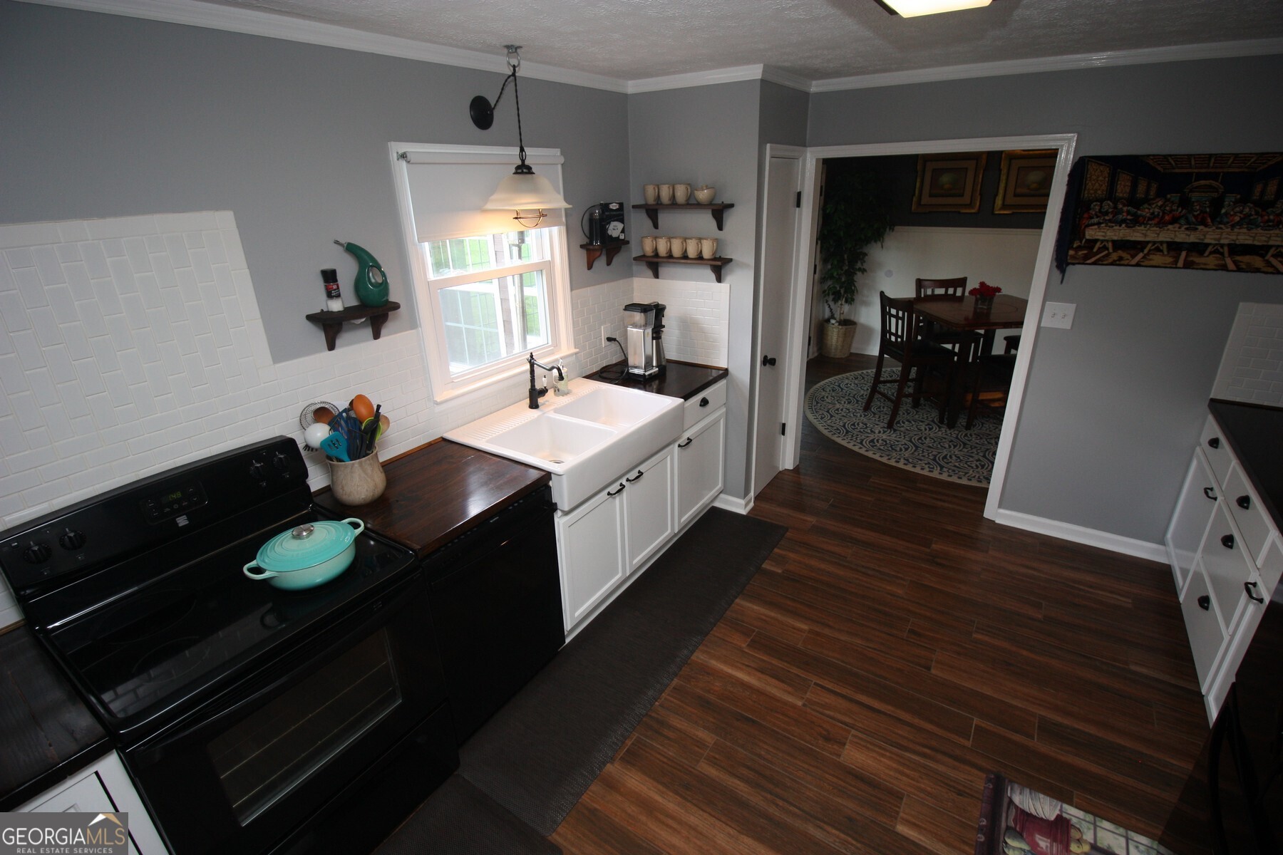 231 Murphy Road LaGrange, GA 30240 - Photo 3 of 24 a kitchen with a sink appliances and cabinets