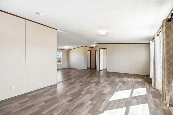 a view of kitchen with window a sink and a refrigerator