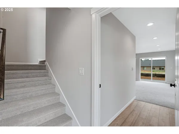 a view of an entryway with wooden floor