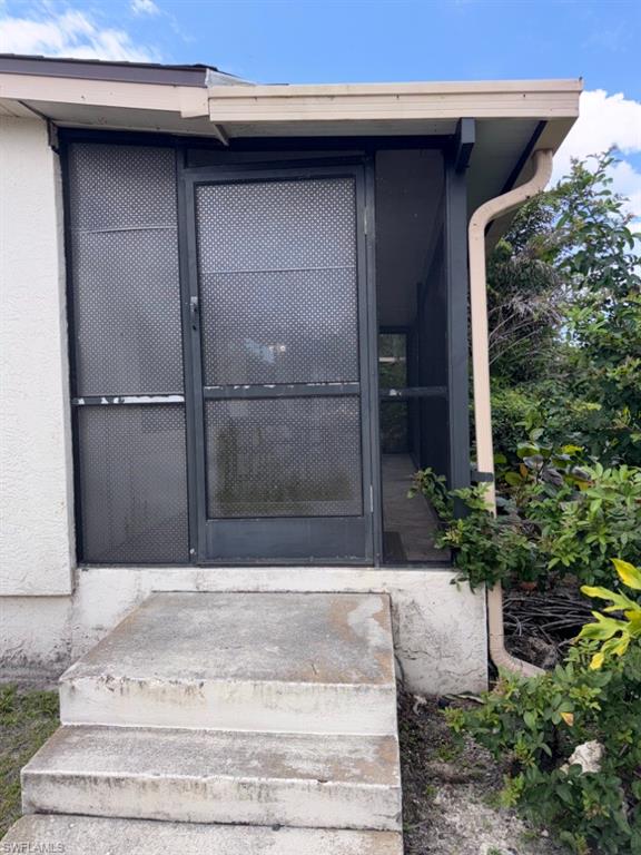 5395 Treetops Drive, Unit I Naples, FL 34113 - Photo 3 of 18 Screened porch entry with concrete steps