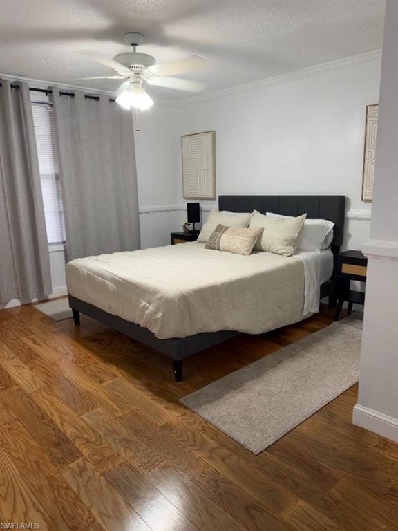 5395 Treetops Drive, Unit I Naples, FL 34113 - Photo 10 of 18 Spacious room featuring wood-finish flooring, white walls, and a ceiling fan with integrated lighting