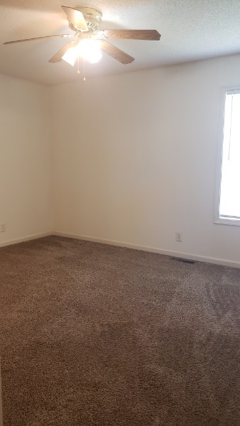 235 State Line Road Oak Grove, KY 42262 - Photo 17 of 18 en empty room with windows and yard