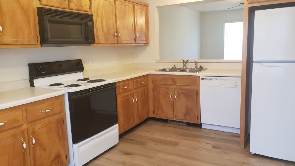 235 State Line Road Oak Grove, KY 42262 - Photo 4 of 18 a kitchen with stainless steel appliances granite countertop a stove a sink and a microwave