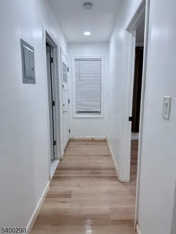 a view of a hallway with stairs