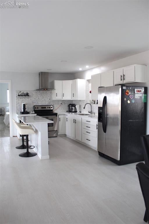 425 Weissenfluh Road Yoder, CO 80864 - Photo 12 of 24 a kitchen with stainless steel appliances granite countertop a refrigerator sink and cabinets