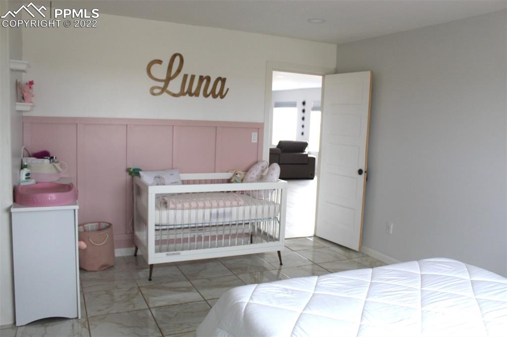 425 Weissenfluh Road Yoder, CO 80864 - Photo 15 of 24 a bedroom with a bed and a window