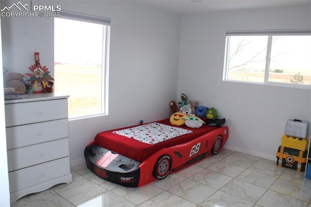 425 Weissenfluh Road Yoder, CO 80864 - Photo 22 of 24 a bedroom with a bed and a window