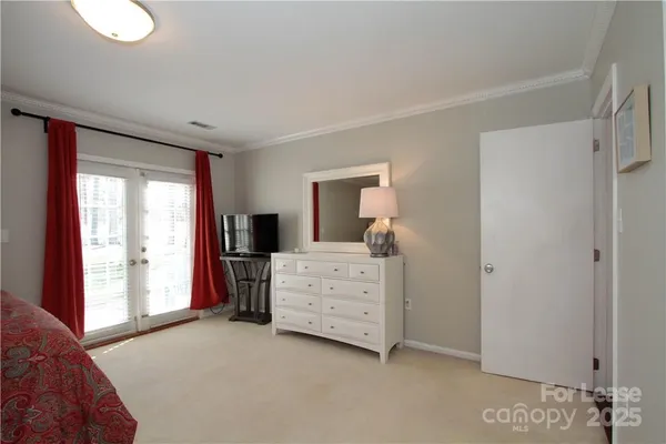 a room with furniture and a dresser
