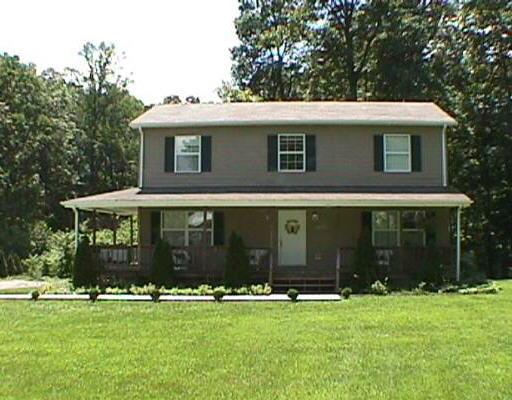 437 Scalybark Drive Blue Ridge, VA 24064 - Photo 1 of 1 a front view of a house with a garden