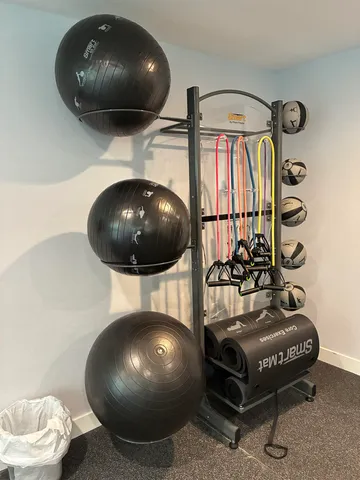 a front view of a oval commercial building with wooden floor