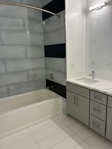 a bathroom with a bathtub and a sink