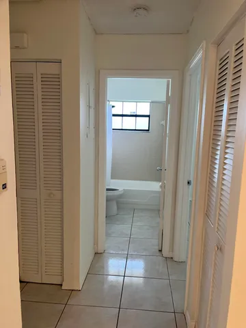 a bathroom with a vanity and a shower