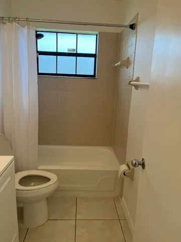 a view of a hallway to rooms