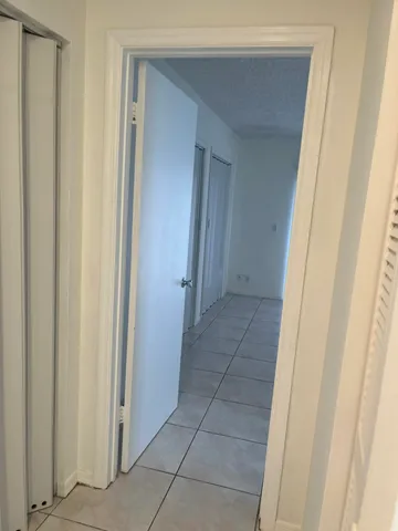 a view of an empty room with a glass door