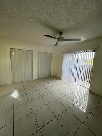 a view of a livingroom with an empty space and a window